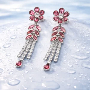 Rose Bloom Chandeliers: Pink Crystal Chandelier Earrings with a floral stud and tiered crystal tassels.